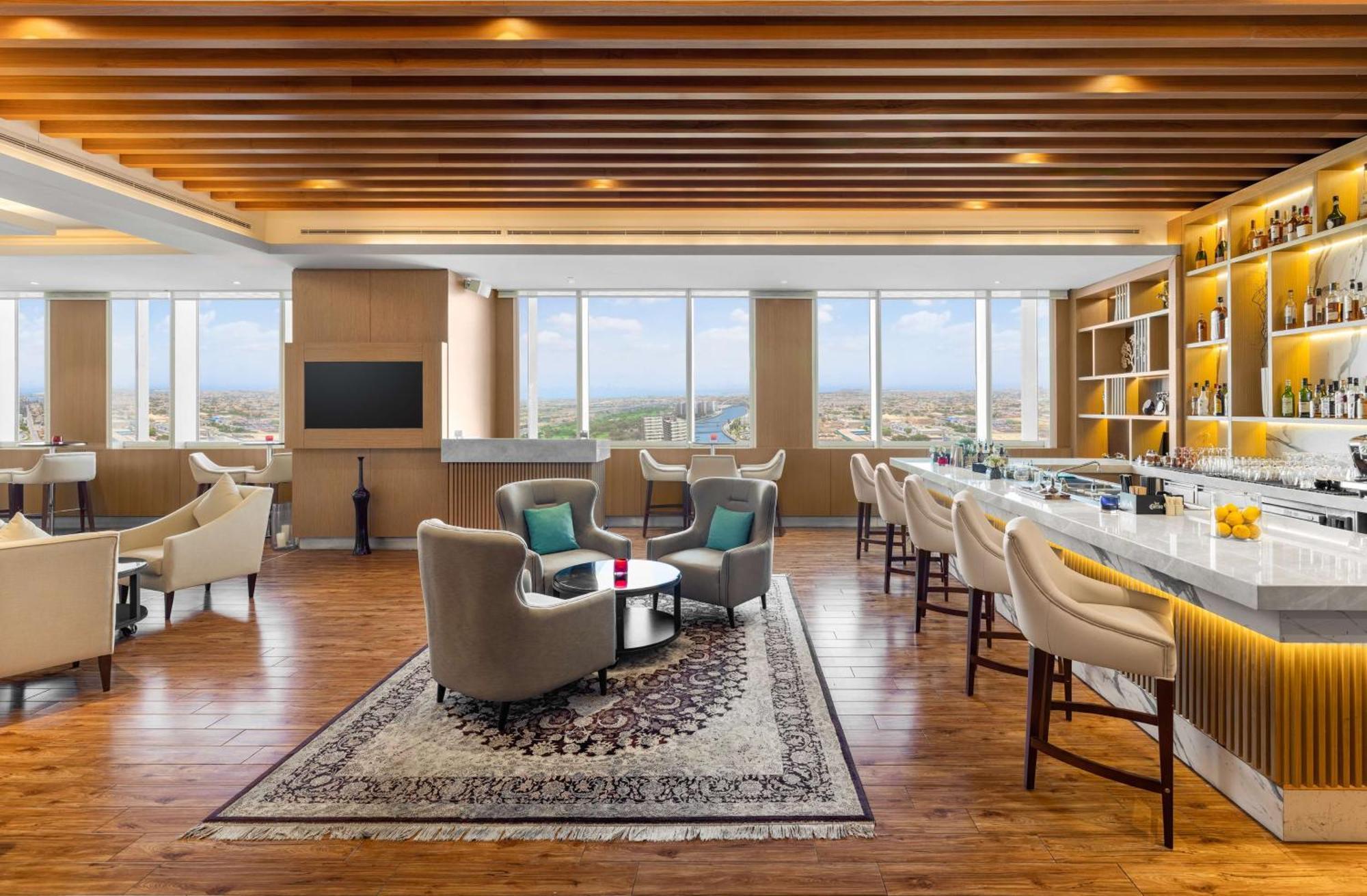 V Hotel Dubai, Curio Collection By Hilton Ngoại thất bức ảnh The Club Lounge at the hotel